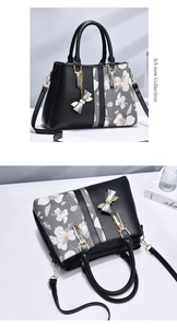Detail of floral printed patchwork handbag featuring a metal bow pendant and dual handles