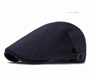 Detail view of the navy vintage beret showing the bronze metal adjustable buckle strap