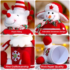 Close-up of reindeer and snowman Christmas candy gift boxes with knitted textures