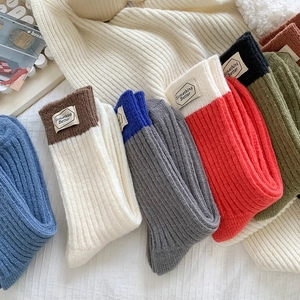 Winter thick wool blend socks with Something Better label in various warm colors