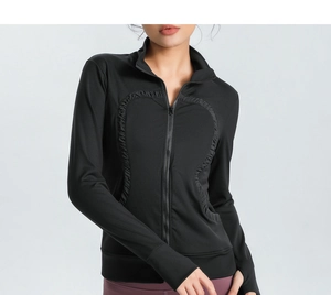 Detail of black slim-fit sports jacket featuring unique heart-shaped stitching and thumbholes