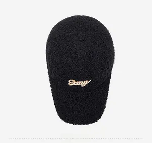 Top view of black lamb wool baseball cap with golden Sany cursive metal letter logo