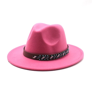 Detail of deep pink wool felt jazz hat featuring an ethnic beaded band and wide brim