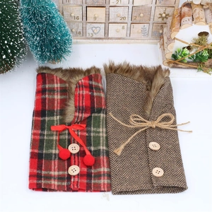 Detail of Christmas wine bottle covers featuring plaid patterns and faux fur collars