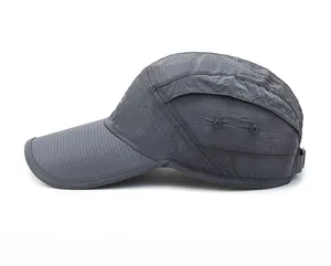 Detail view of grey quick-dry sports cap featuring ripstop mesh fabric and side metal vents