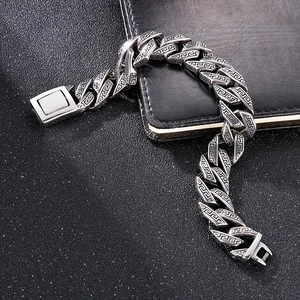 Men's stainless steel Cuban chain bracelet with intricate Greek key pattern engravings