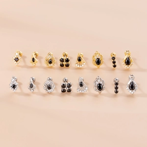 Set of 16 gold and silver stainless steel screw back ear studs with black zircon stones