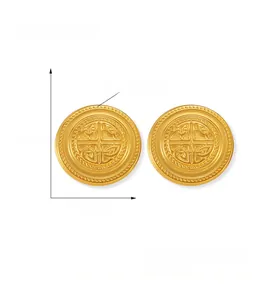 Detailed macro view of vintage titanium steel gold studs with embossed geometric pattern