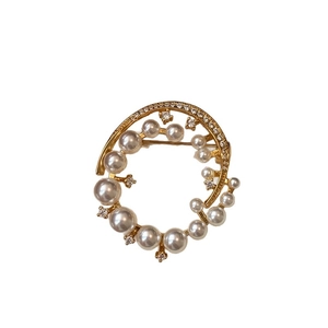 Elegant 24k gold-plated spiral brooch with glossy white pearls and sparkling zircons