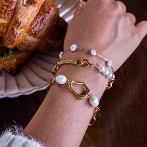 Three-layer faux pearl and gold stainless steel bracelet set for women's elegant styling