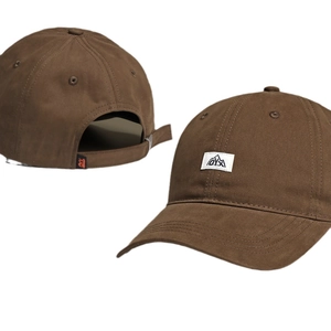 Brown cotton baseball cap with mountain patch and adjustable strap shown in dual views