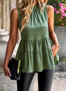 Detail of green leopard jacquard sleeveless tiered top with ruffled layers and shiny fabric