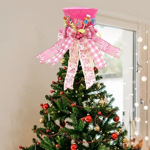 Pink gingerbread man top hat Christmas tree topper with bows and candy decor