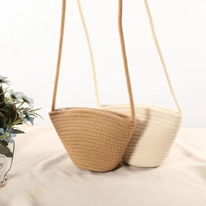 Detailed texture of woven cotton shell bags in light brown and cream white colors