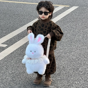 Toddler leopard knit tracksuit paired with a large white plush bunny backpack for kids