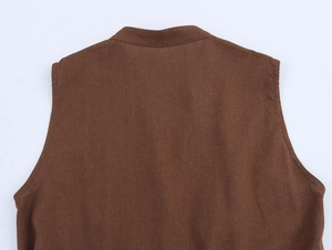 Detail view of the brown sleeveless dress back showing textured linen-like fabric and stitching