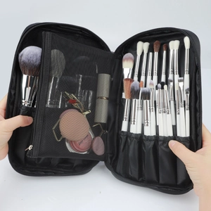 Detail of the large capacity makeup brush bag with mesh pockets and folding inner slots