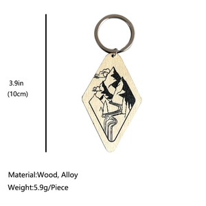 Western cowboy style wooden diamond keychain with engraved desert mountains and dimensions