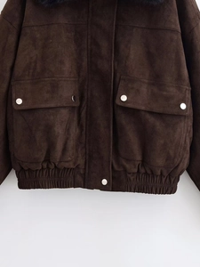 Detail of brown faux suede jacket featuring black faux fur collar and metal buttons