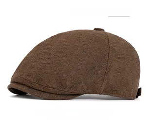 Detail of coffee-colored cotton linen flat cap with six-panel design and fabric texture