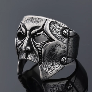 Macro shot of gothic mask ring in vintage silver finish with antique metal texture