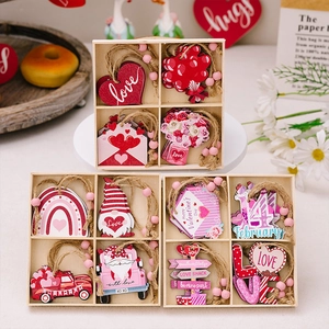 Detailed view of pink wooden Valentine's Day heart ornaments in a decorative gift box