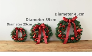 Three Christmas wreaths in 25cm, 35cm, and 45cm diameters with red bows and pine cones