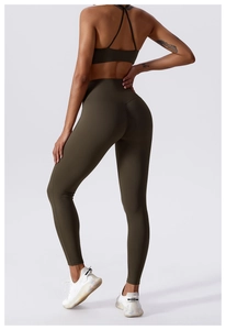 Detailed back view of high-waisted olive green yoga leggings with lifting seams