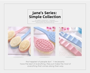 Close-up of dual-sided bath brush head with soft bristles and massaging nodes