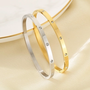 Titanium steel couple bracelet with sparkling white zircons in gold and silver finish