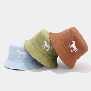 Corduroy bucket hat with horse embroidery in light blue, olive green, and reddish brown