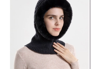 Detail of black knitted balaclava with faux fur trim for winter thermal protection