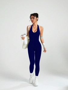 Detail of navy blue halter backless yoga jumpsuit showing seamless stretch fabric and fit