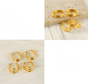 Detail of multi-layered gold hoops with polished finish and vacuum plating texture