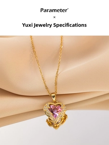 Macro shot of heart-shaped pink crystal necklace on a reflective mirror with silk background