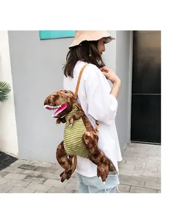 Detail of cute dinosaur plush backpack showing corduroy texture and outdoor style