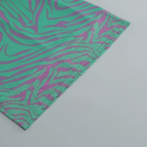 Close-up of the fine stitching and purple zebra print hemline on a bodycon dress