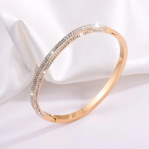Elegant rose gold titanium bangle with double row pavé white crystals on white silk