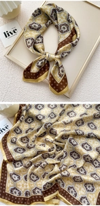 Detailed view of ginger floral silk scarf with retro paisley pattern and satin finish