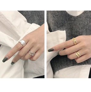 Detail view of S925 sterling silver rings with irregular textures and thorn patterns