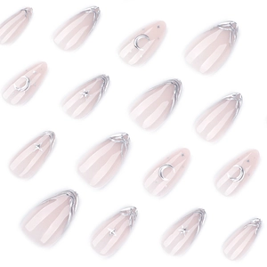 3D silver moon and star press-on nails with nude base and french almond shape