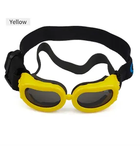 Detail of yellow pet goggles with dark UV lenses and adjustable elastic headband