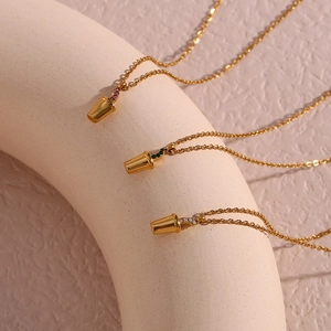 Detailed view of 18K gold-plated coffee cup pendant necklace with colorful zircon stones