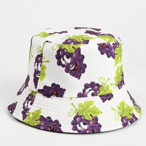 Close-up of white bucket hat with cute cartoon grape print and soft polyester cotton fabric