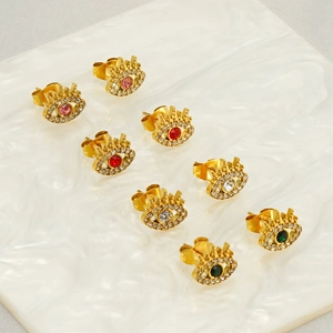 Detailed view of four pairs of gold-plated evil eye stud earrings with colorful zircon stones
