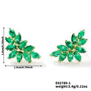 Detail view of emerald green leaf earrings with dimensions and gold-plated setting