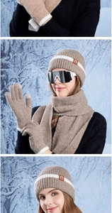 Detailed knit texture of khaki winter hat, scarf, and touch-screen gloves with logo patch