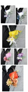 Detailed view of artificial calla lily and rose boutonniere on a gray suit lapel