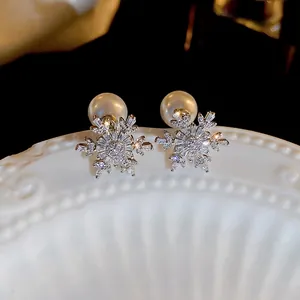 Elegant silver snowflake pearl earrings with cubic zirconia for Christmas festive style