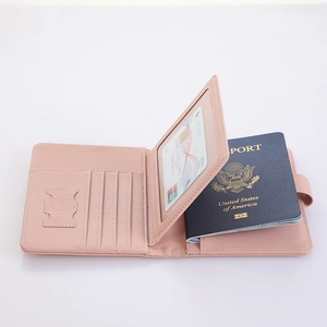Pink PU leather passport holder interior with card slots, SIM holders, and documents